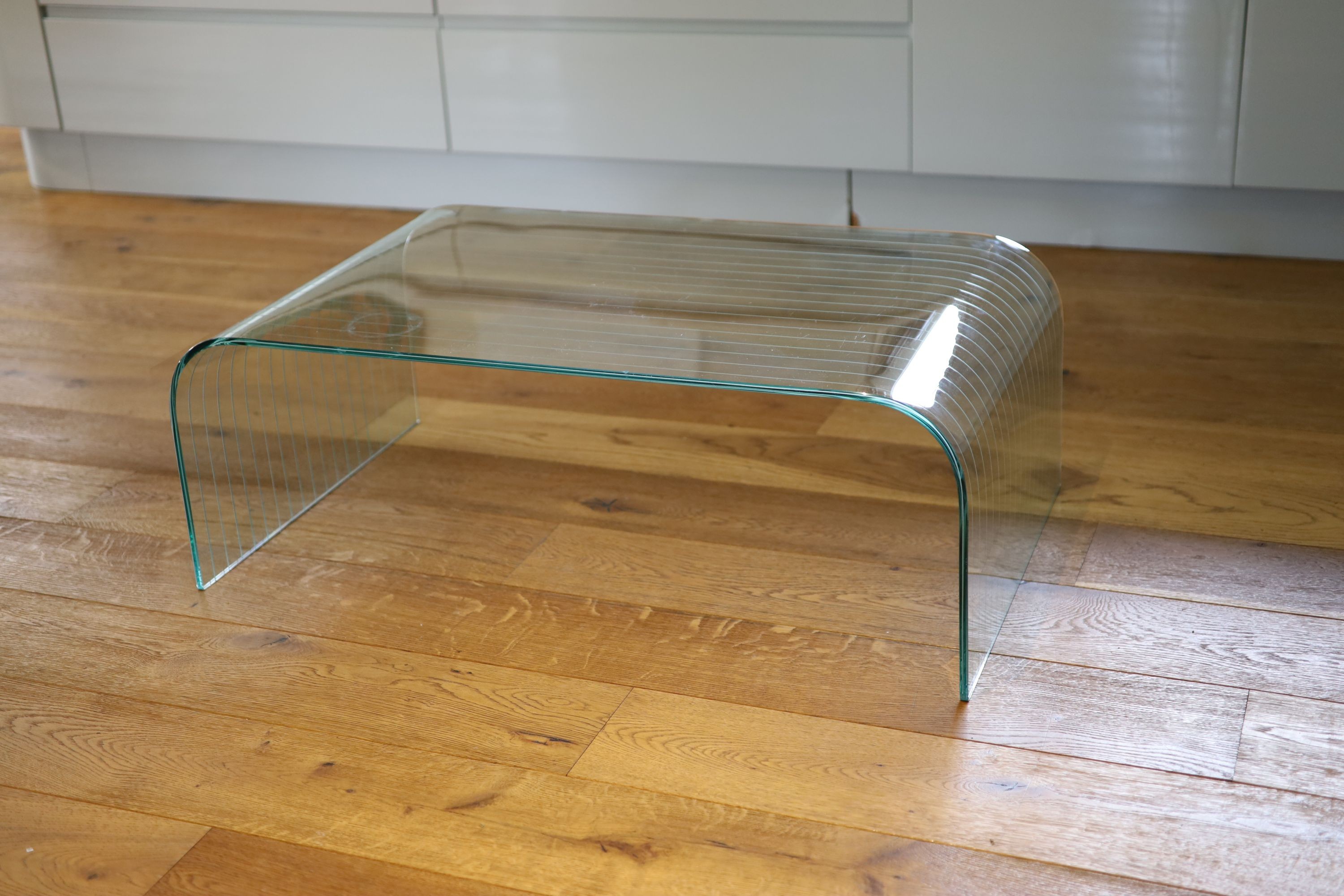 A ribbed glass waterfall coffee table, width 101cm depth 60cm height 36cm